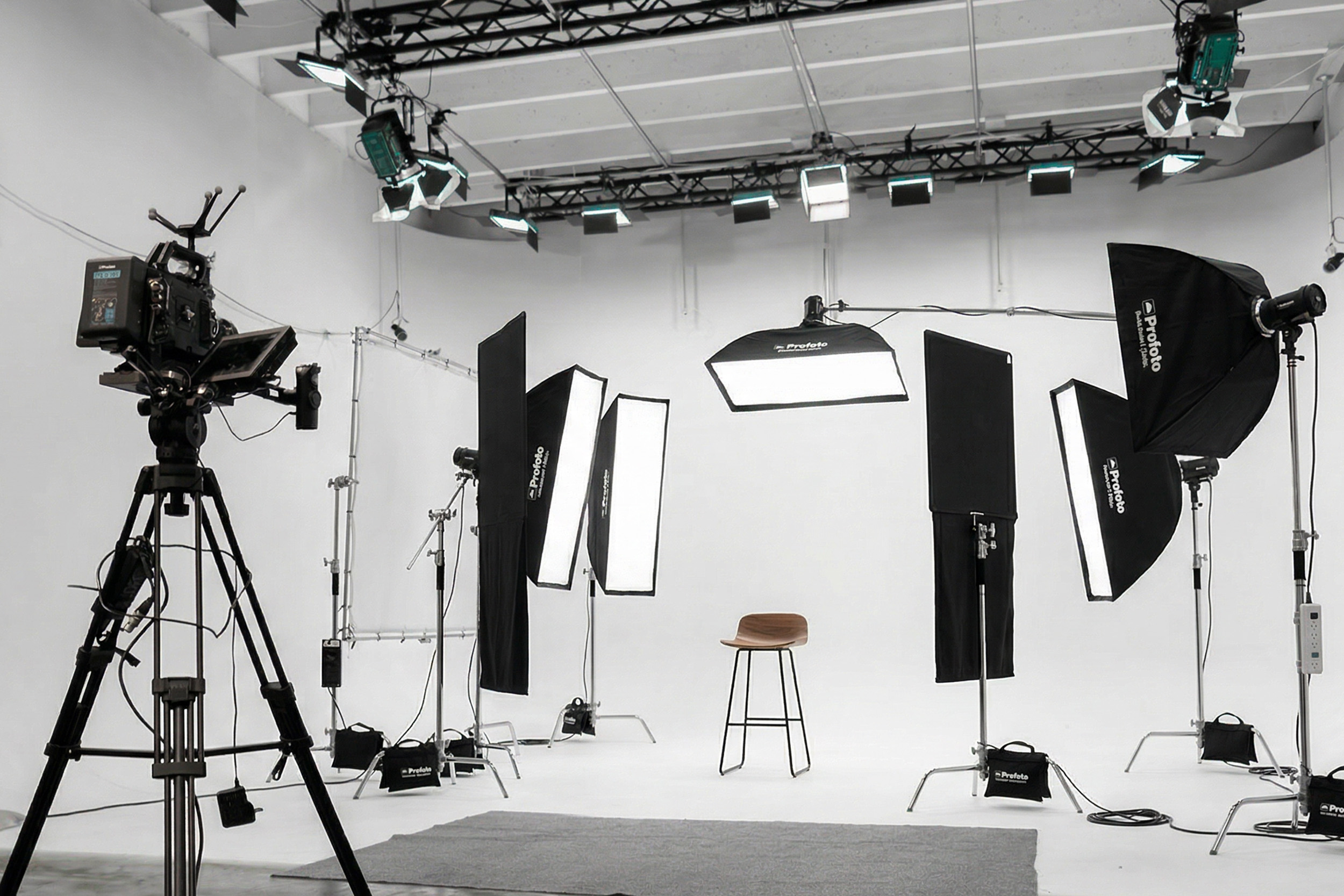 Commercial photo set in a Miami production studio with professional lighting, softboxes, and camera equipment